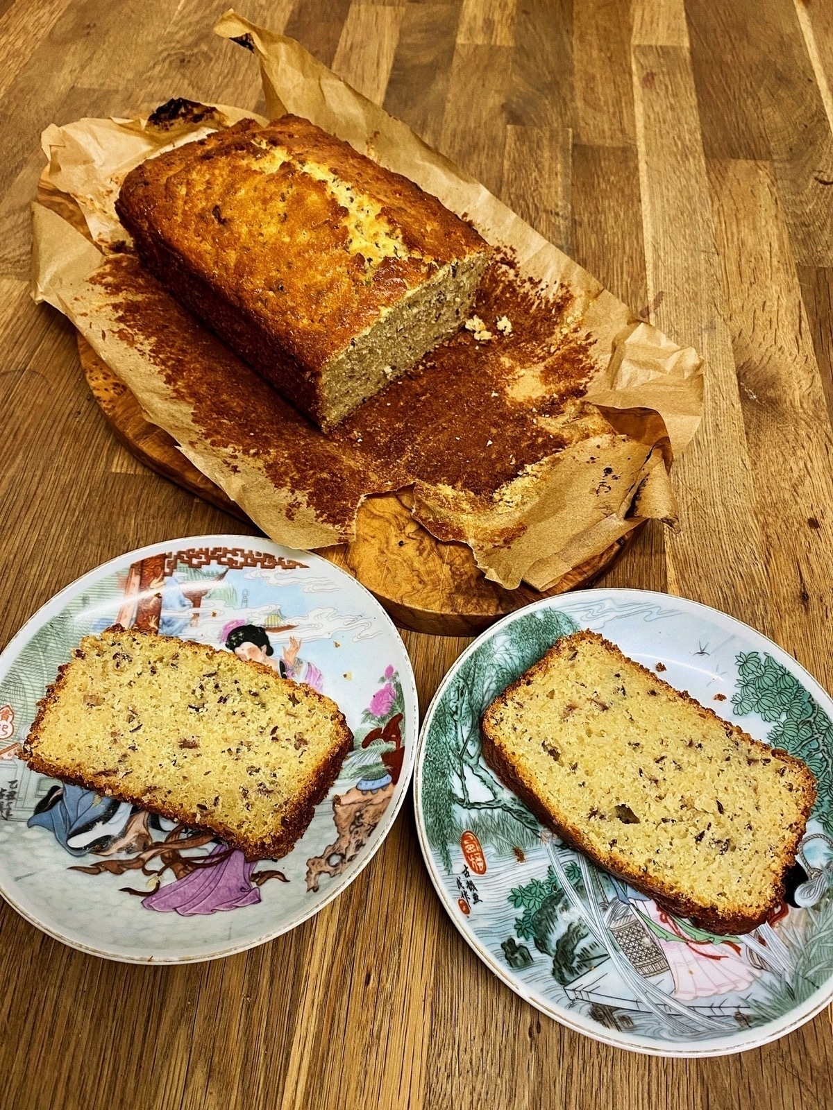 Cut loaf cake plus two slices on two small plates