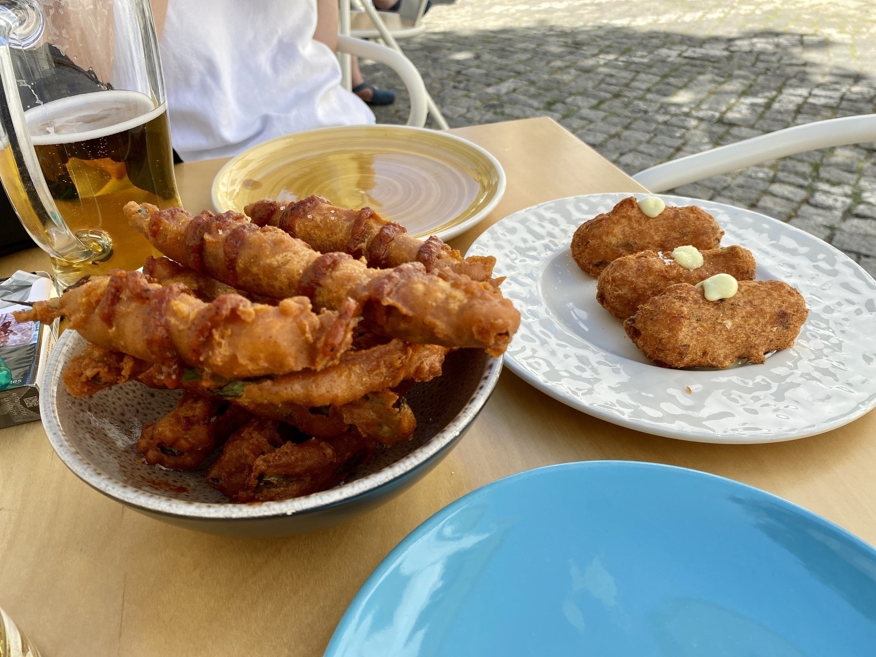 Plates of fried food on a table