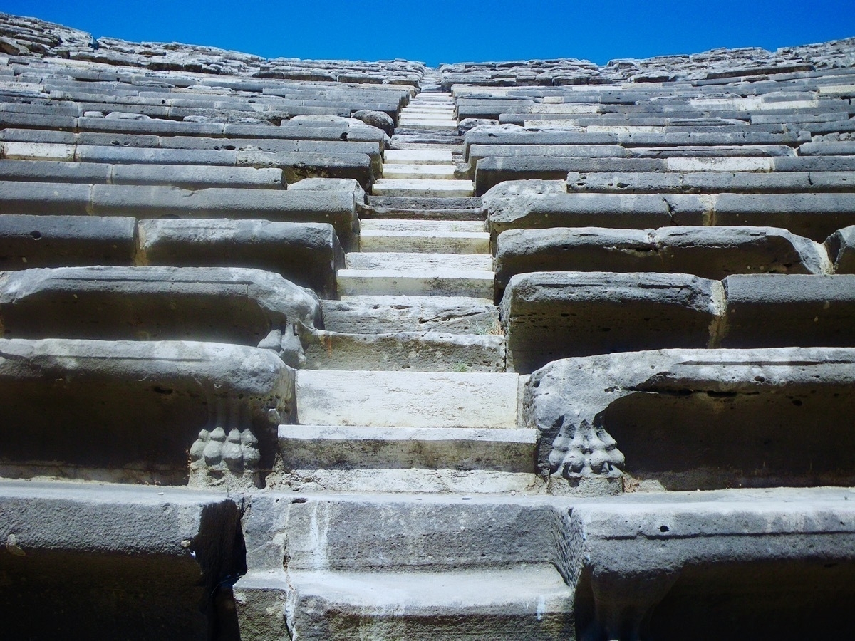 Close up of steep stone steps and seating of a Roman amphitheatre