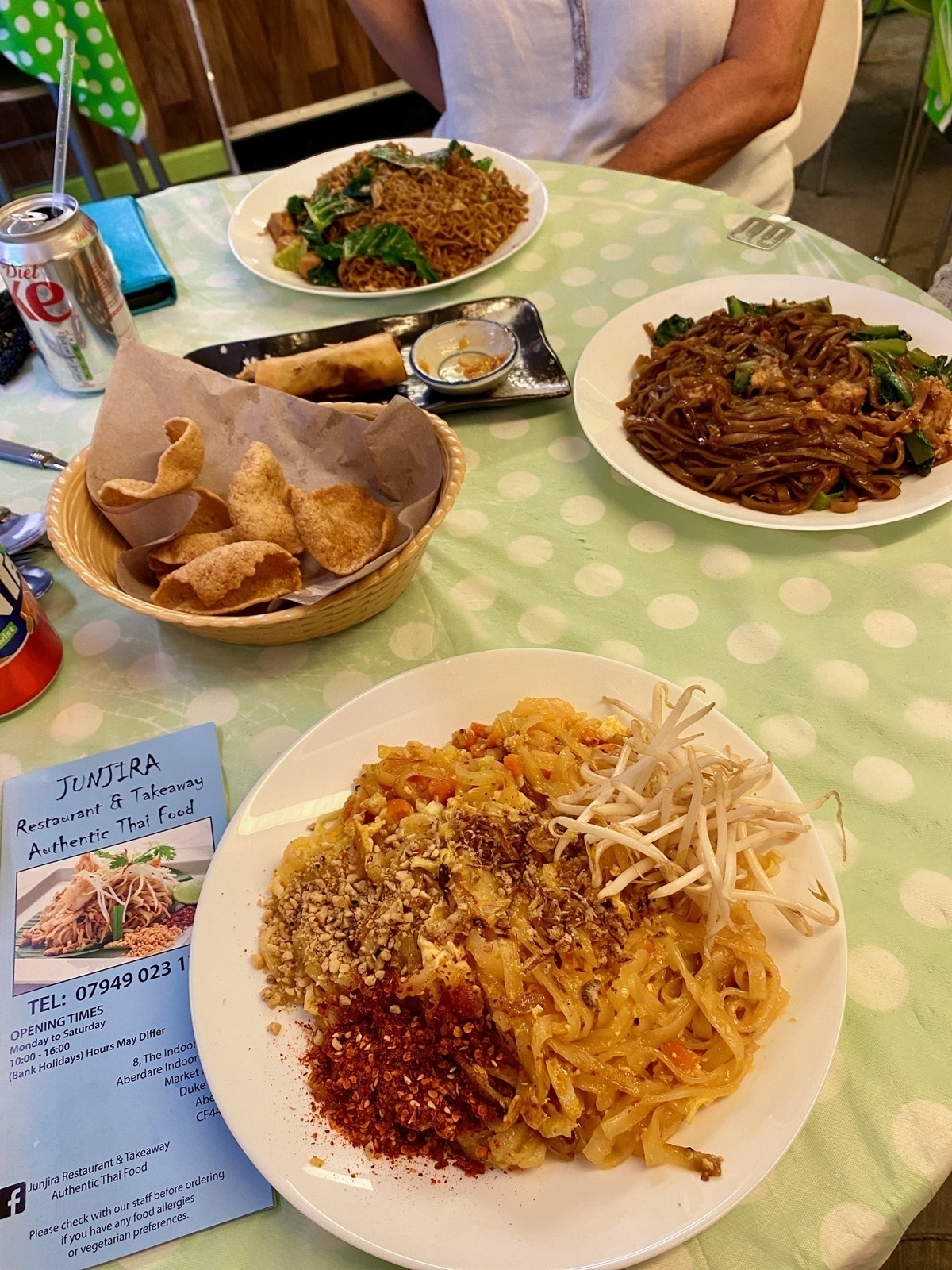 Thai noodle dishes on restaurant table