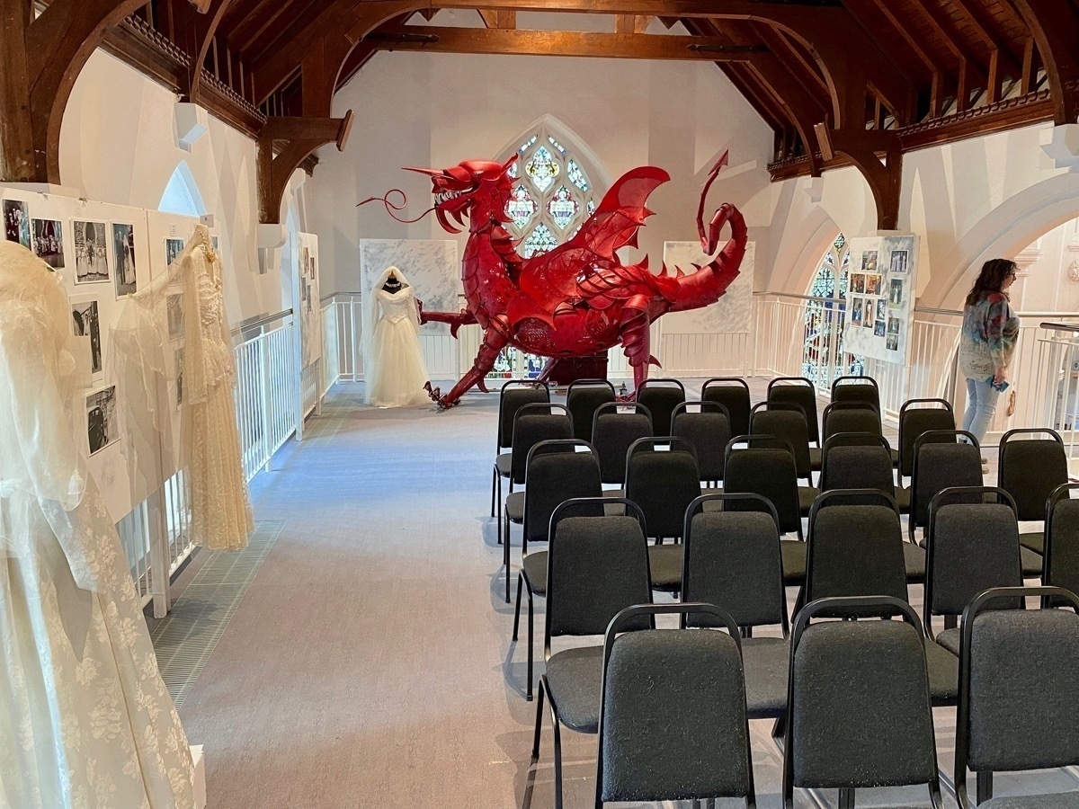 Red Welsh dragon steel sculpture in a small conference room